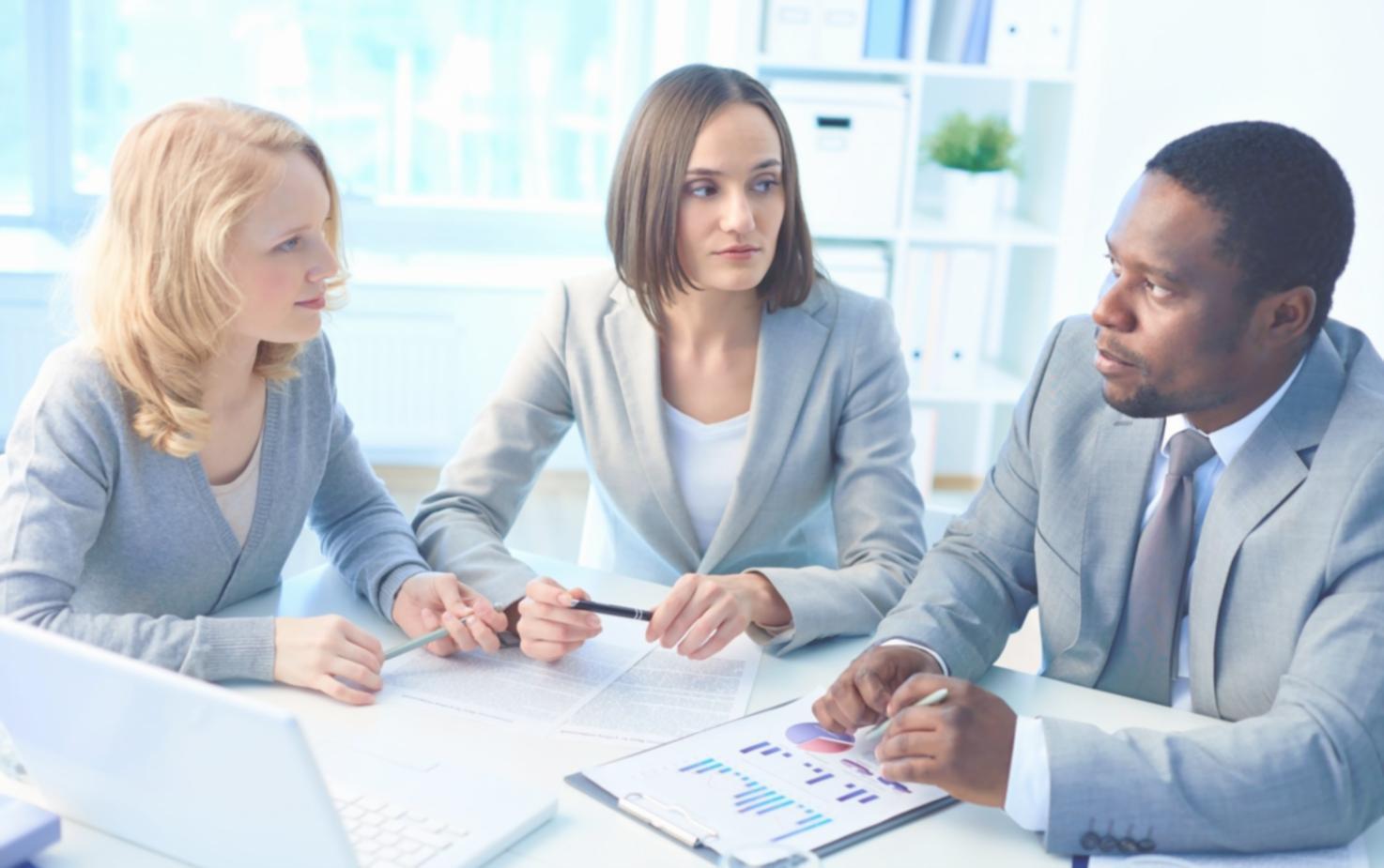 Financial professionals analyzing market data and economic indicators